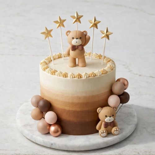 Cake with teddy bear decoration on a marble board