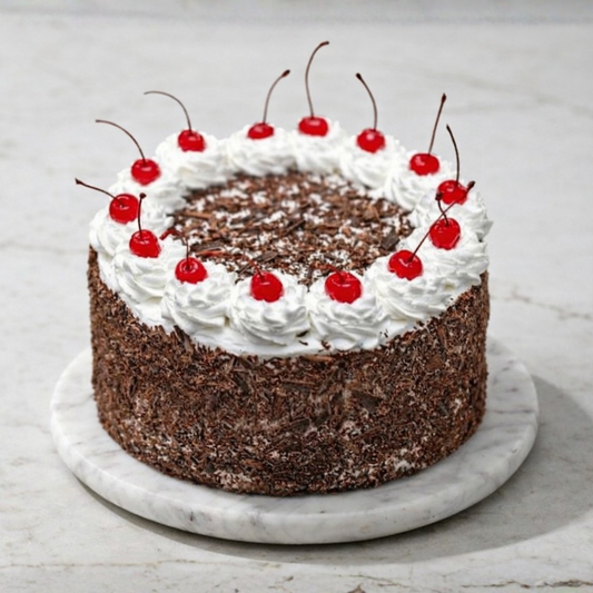 Black Forest Treasure cake with dark chocolate layers, white cream, and fresh red cherries - Toromi Bakehouse