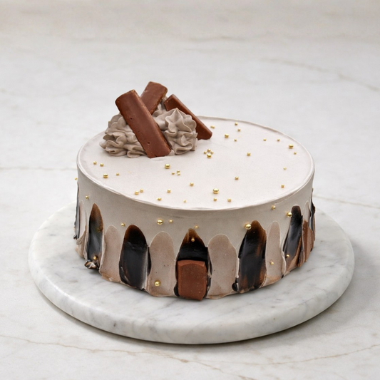 Decorative cake with chocolate elements on a marble stand