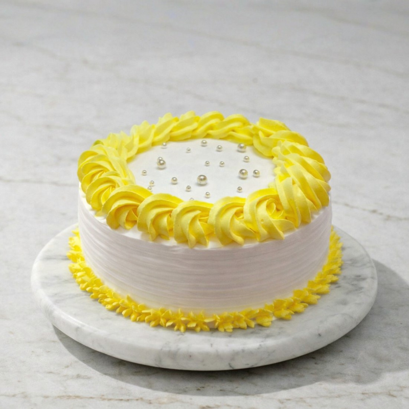 Yellow Piped Elegance Cake with yellow rosettes on top and middle, displayed on a marble stand.